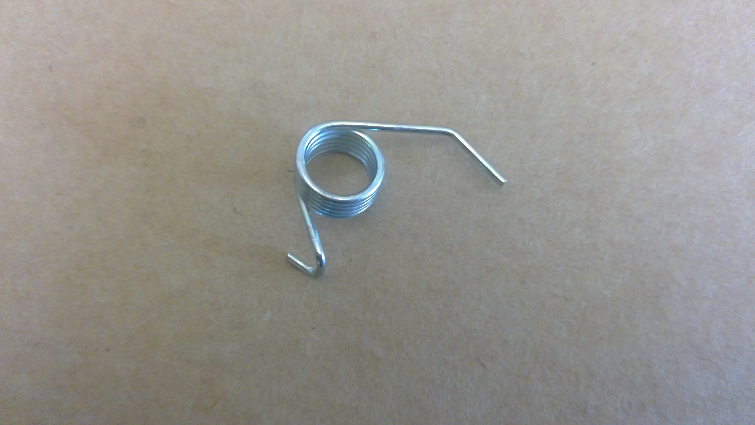 FUEL DOOR CATCH SPRING 573090NG 1