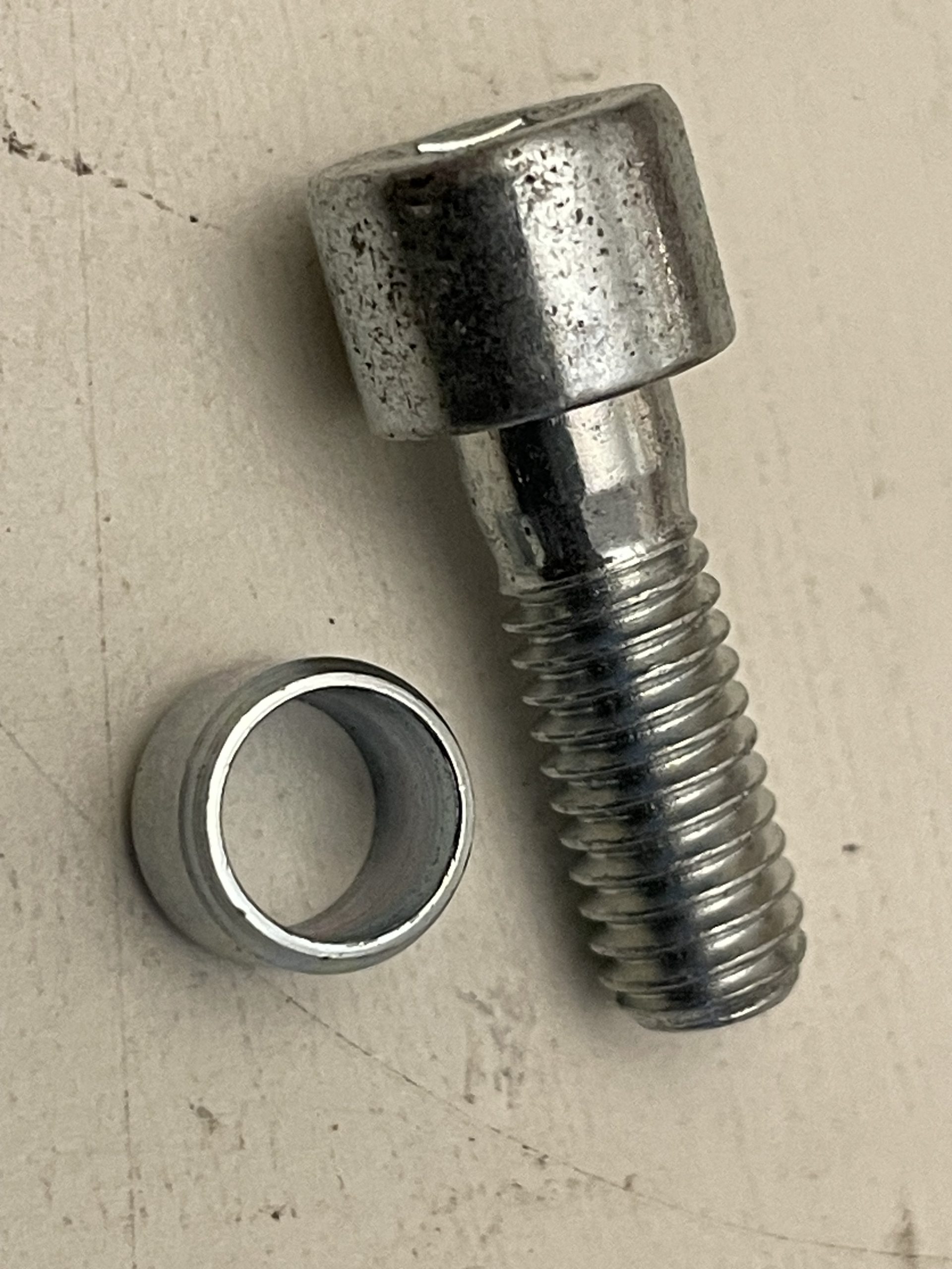 BRAKETHROTTLE SECURING SCREW AND CABLE BARREL 123394NG